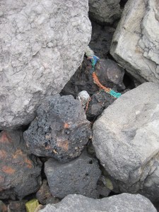 Limestone blocks holding back the rusty slag
