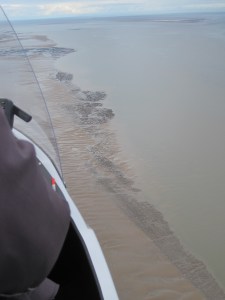 Lines of rocks at right-angles to the sand-waves